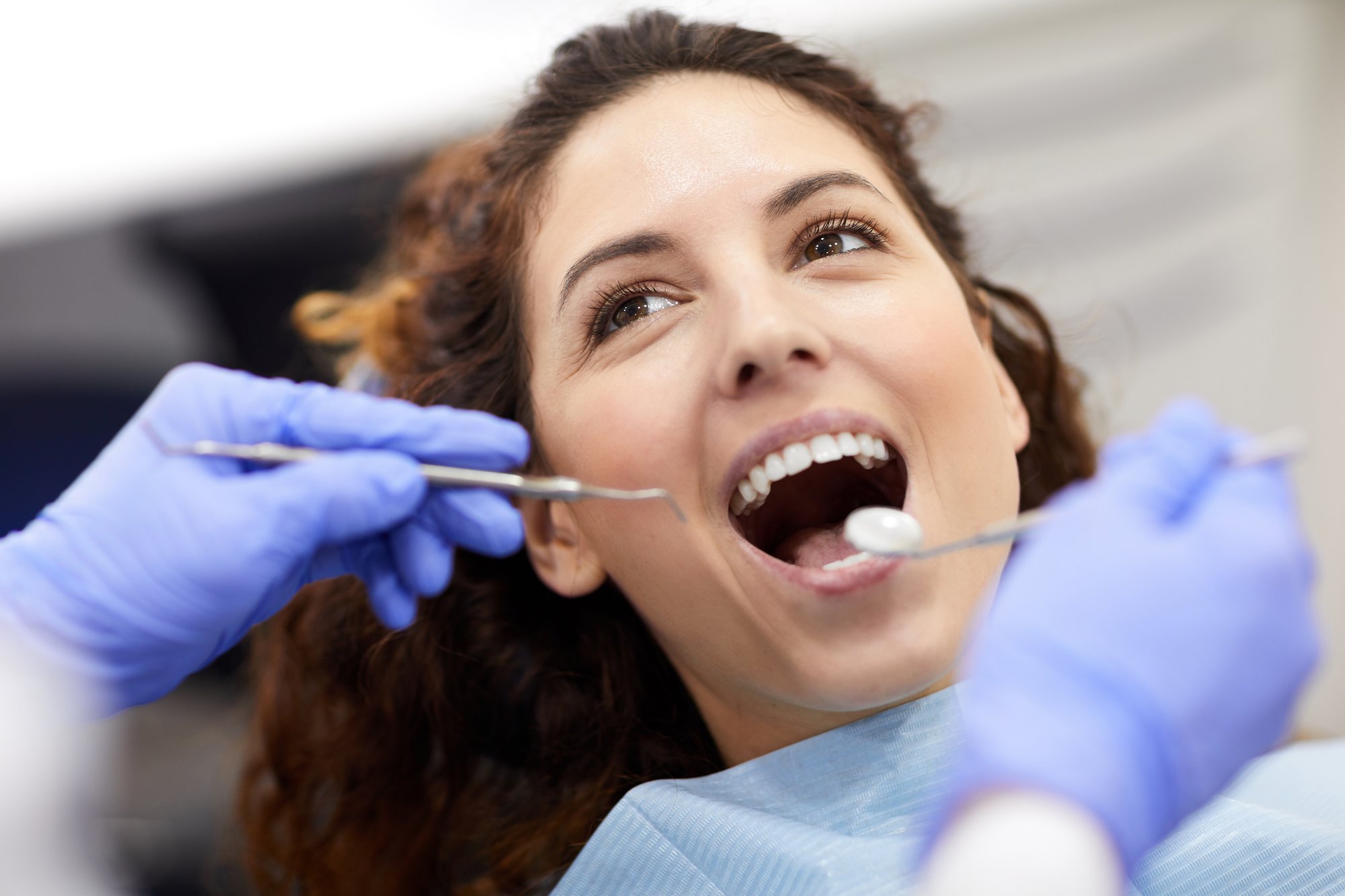 Smile after gum contouring showing longer, balanced front teeth